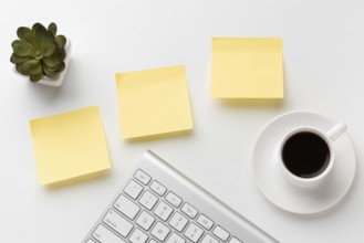 Flat lay office desk assortment with empty post its. Beautiful photo