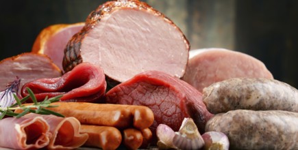 Assorted meat products including ham and sausages