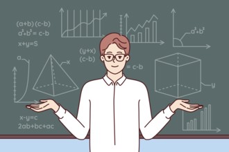 Man mathematics teacher stands near school blackboard with formulas and geometric drawings. Young