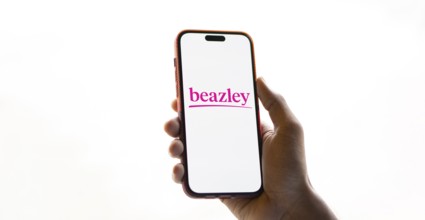Beazley logo is displayed on smartphone. Beazley plc is the British parent company of specialist