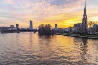 View across the River Main to the ECB and the Protestant Church of the Epiphany. Sunrise in the