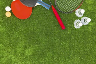 Ping pong balls shuttlecocks badminton rackets green turf