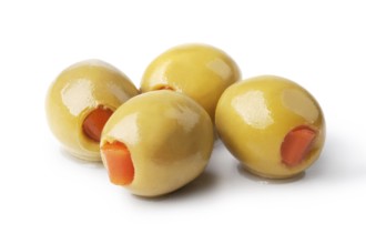 olives into bowls on wooden table