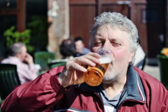 Thirsty man drinks a beer