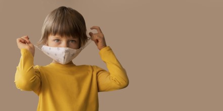 Boy wearing medical mask with copy space