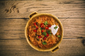 Hungarian Szegedin Goulash with pickled white cabbage (sauerkraut), onion and bread dumplings in