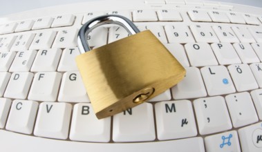 A padlock on a computer keyboard. Data security and protection, A padlock on a computer keyboard.