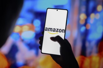 In this photo illustration, the Amazon logo is displayed on a smartphone screen