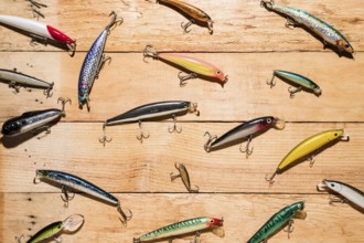 Colorful fishing lures wooden desk