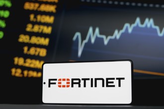 In this photo illustration, the Fortinet logo is displayed on a smartphone screen