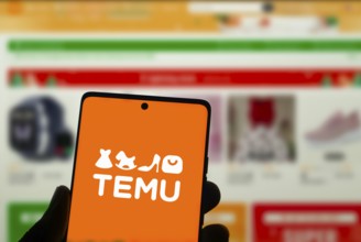 Temu logo online marketplace ecommerce on a smartphone and computer in Stuttgart, Germany.