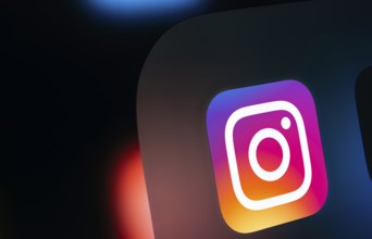 A close up of an iPad screen displaying the instagram app icon