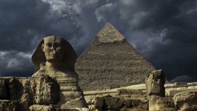 Great pyramid and sphinx and dark storm clouds in Giza Cairo, Egypt, Africa