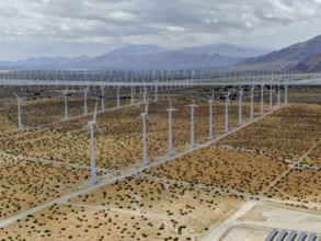Aerial view of huge array of gigantic wind turbines spreading over the desert in Palm Springs wind