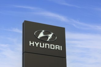 Hyundai Motor Company logo outside dealership. Hyundai is a South Korean multinational automotive