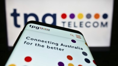 Stuttgart, Germany, 12-30-2022: Mobile phone with website of Australian company TPG Telecom Limited