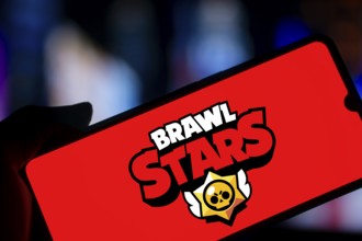 brawl stars logo is displayed on smartphone. Brawl Stars is a multiplayer online battle arena video