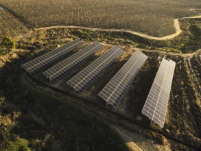 Aerial view of solar power plant solar panels on vineyard. Electric panels for producing clean