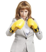 Portrait of a young businesswoman wearing boxing gloves