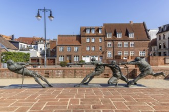 Walled-up ground plan of the former St Mary's Church and sculpture Tug of War - The Strongest by