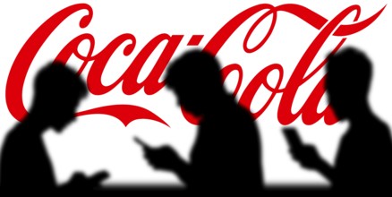 Smartphone on surface showing Coca-Cola logo