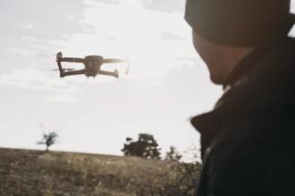 Close up man watching drone. Beautiful photo
