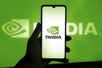 Dhaka, Bangladesh 11 Nov 2024: Nvidia logo on smartphone screen with AI in the background. Nvidia