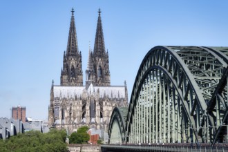 View across the Rhine along the Hohenzollern Bridge to Cologne Cathedral in the warm morning light