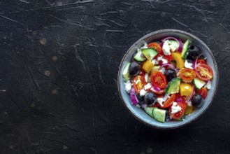 Greek salad. Fresh tomato, cucumber, bell pepper, Feta cheese, onion, and olives. Healthy summer