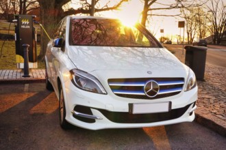Mercedes-Benz B-Class Electric Drive electric car plugged in at public HELEN charging point.
