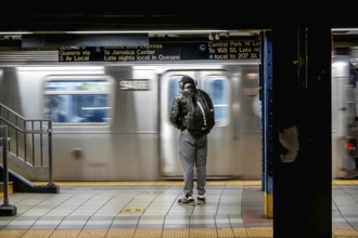 January 16, 2023, New York, NY, USA: Passengers wait for their train on the New York subway system