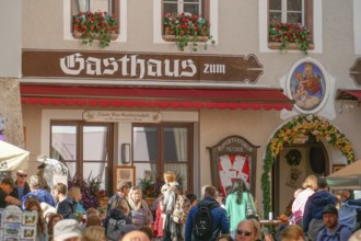 Old inn with many people in the old town, Berchtesgaden, Berchtesgadener Land, Upper Bavaria,