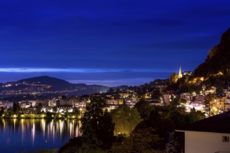Switzerland, Montreux, cityscape dusk night view with Lake Geneva and Alps, Europe