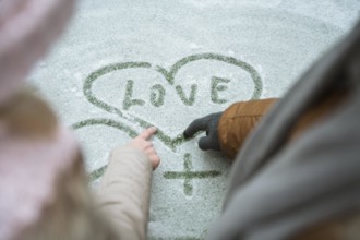 Couple winter writing love snow