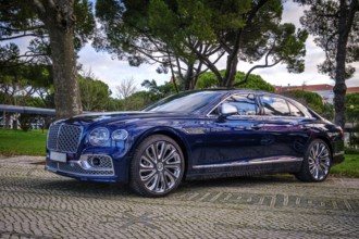 Lisbon, Portugal, Jan 20, 2024: Luxury Bentley Flying Spur Mulliner parked on a cobblestone road,