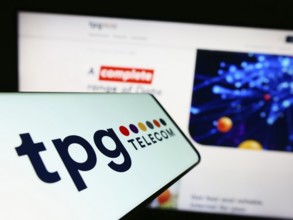 Stuttgart, Germany, 12-30-2022: Cellphone with logo of Australian company TPG Telecom Limited on