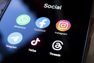 In this photo illustration, WhatsApp, Facebook, Instagram, Telegram, TikTok and Threads apps