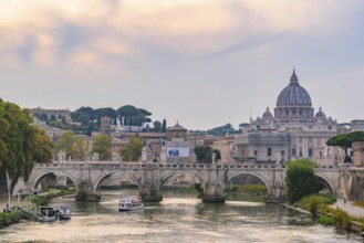 Sunset view of St. Peter's Basilica, Ponte Sant'Angelo, and Tiber River in Rome, Italy, Europe