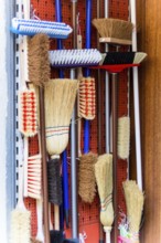 Cabinet with different types of brooms Austria