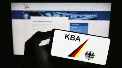 Stuttgart, Germany, 09-17-2023: Person holding cellphone with logo of German federal agency