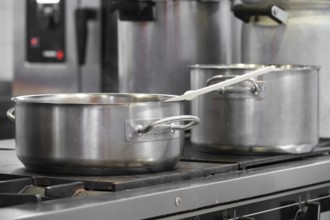 Close up view of casseroles at a commercial kitchen. Preparing and cooking food in a commercial