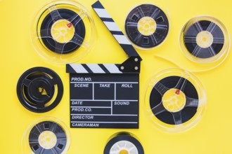 Arrangement film reels clapboard. Beautiful photo
