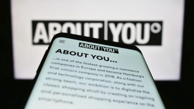 Stuttgart, Germany, 03-14-2023: Smartphone with webpage of German e-commerce company About You SE