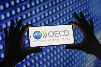 In this photo illustration, the Organisation for Economic Co-operation and Development (OECD) logo