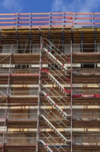 Construction site with scaffolding, shell of a residential building, Bremen, Germany, Europe