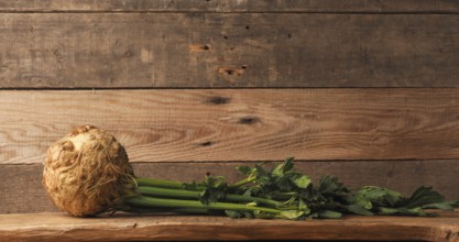 Organic celeriac on a rustic wooden table, healthy food, space for your text, organic ingredients,