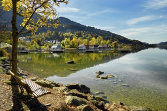 Lakeside path and boathouses on the autumnal large Alpsee lake near Bühl, Immenstadt Im Allgäu,