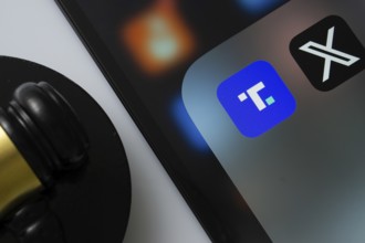 A close up of an iPad screen displaying the Truth Social and Twitter (X) app alongside a judge's