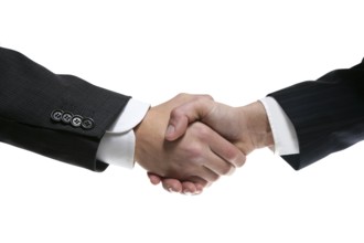 Businessman teamwork partners shaking hands with suit