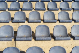 Rows with blue seat shells on a sports stand
